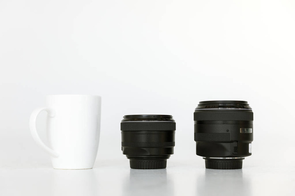 lenses and coffee mug - Fotó, kép