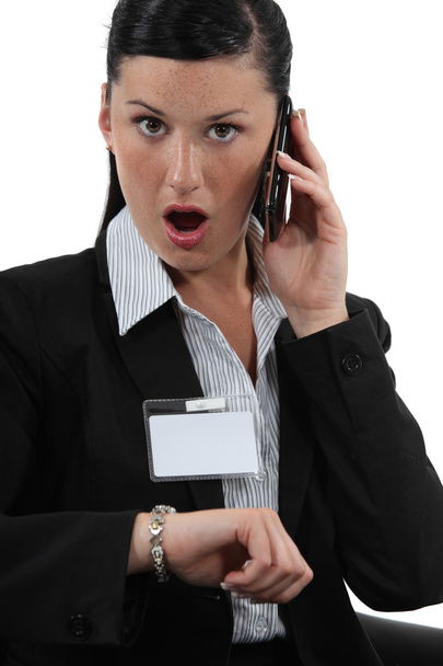 Shocked businesswoman talking on her cellphone - Zdjęcie, obraz