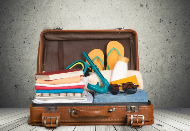 Retro suitcase with colorful clothes, travel concept - Foto, Imagem