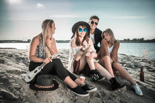 Friends having fun and enjoying beach festival, youth concept - Photo, image