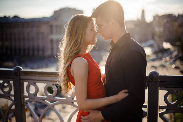 Young couple in love on the background of beautiful city - 写真・画像