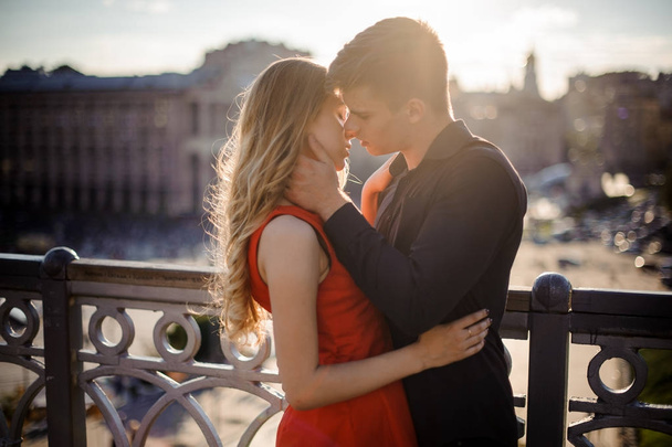 Couple in love on the background of beautiful town - 写真・画像