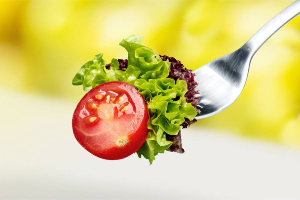 Fresh raw vegetables on fork - Photo, Image