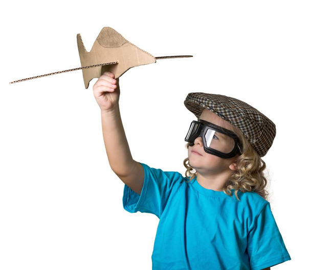 Little boy with wooden plane - Фото, зображення