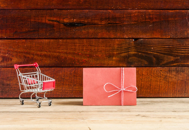 shopping cart on the wooden floor - 写真・画像