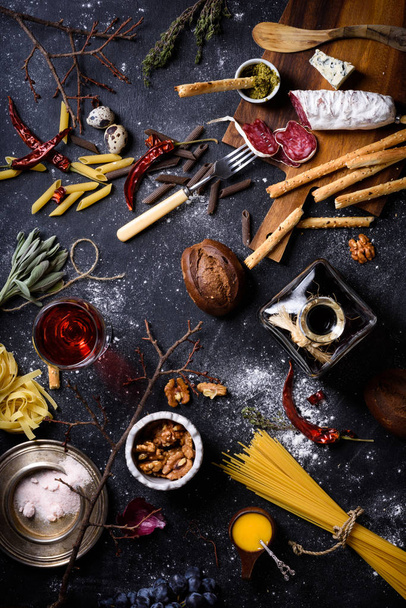 Appetizer, Italian kitchen ingredients. Pasta with antipasto. Top view. - Valokuva, kuva