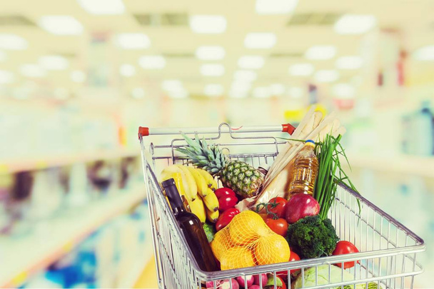 shopping cart full of groceries - Foto, Imagem