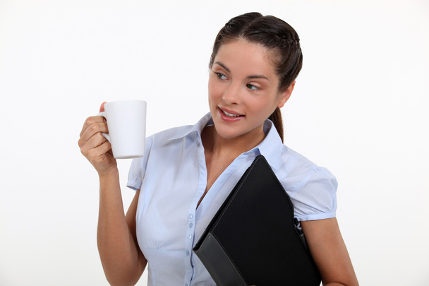 Businesswoman with a hot drink - Foto, Imagen