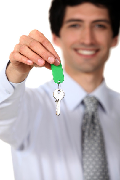 Estate agent with a key - Foto, Bild
