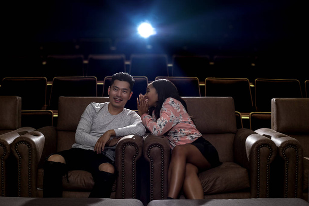 Interracial couple on a movie theater date - Photo, Image
