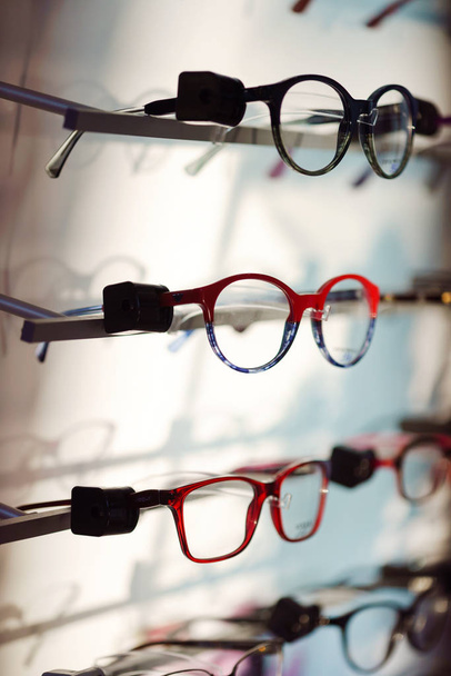 glasses in optical shop - 写真・画像