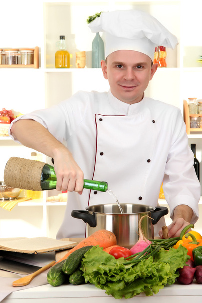 Chef cooking in kitchen - Фото, зображення