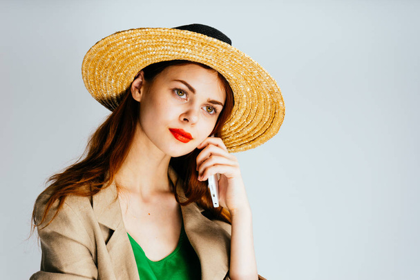 beautiful girl in a hat and with red lips reflected, isolated - Photo, image