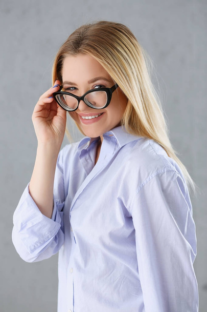 Portrait of a sexy woman in a man's shirt wearing glasses - 写真・画像