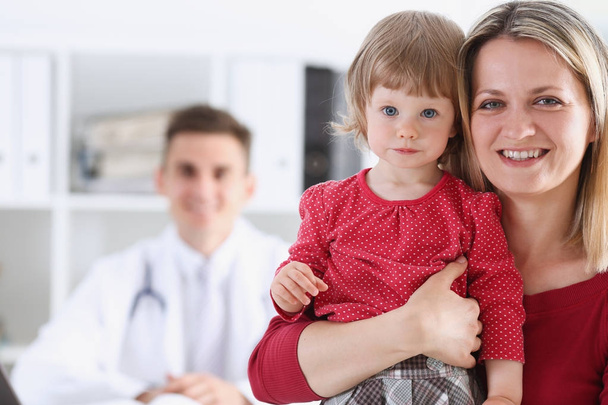 Little child with mother at pediatrician reception - Photo, Image