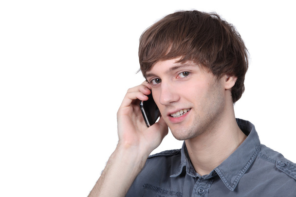 Young man talking on his cell - Foto, imagen