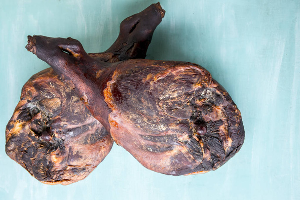 Jamon serrano. Traditional ham on turquoise background - Photo, Image