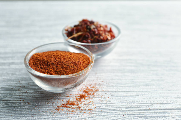 Chili powder and flakes in bowls - Photo, Image