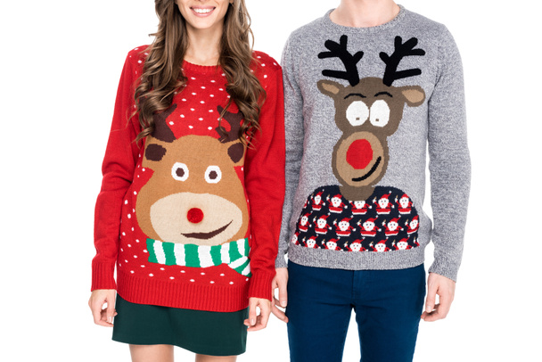 couple in winter festive sweaters - Фото, изображение