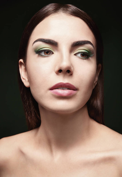 Young beautiful woman with fancy makeup - Foto, imagen