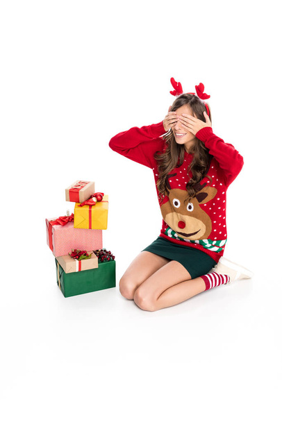 woman in sweater and christmas presents - Photo, Image