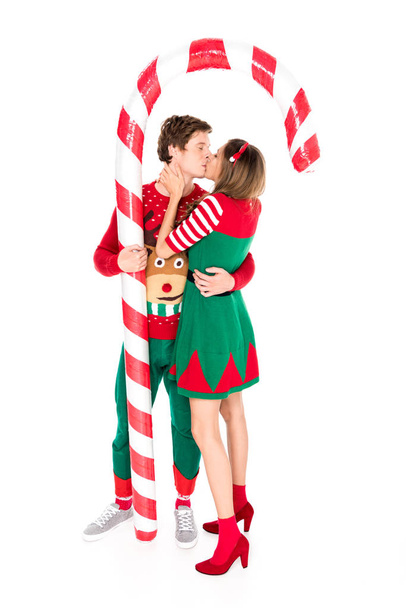 couple in costumes kissing each other - Foto, Imagen