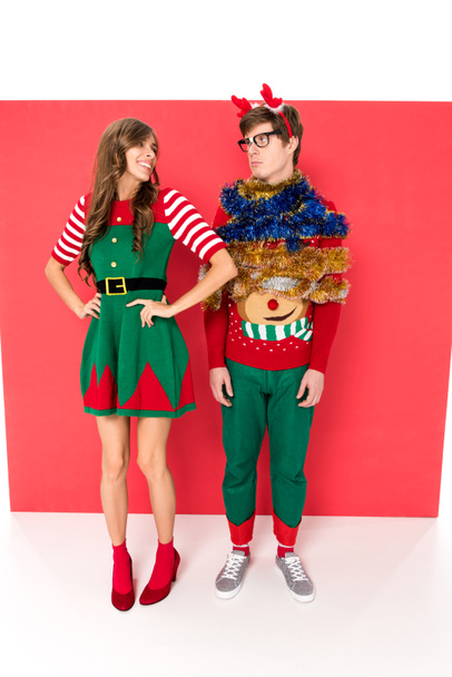 couple in christmas costumes - 写真・画像