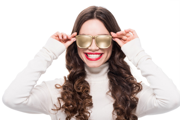 Cheerful woman in gold sunglasses - Photo, Image