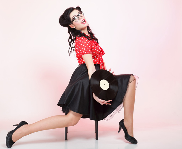 Pin-up girl style retro woman analogue record - 写真・画像