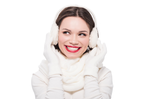 Woman with red lips in earmuffs - Photo, Image