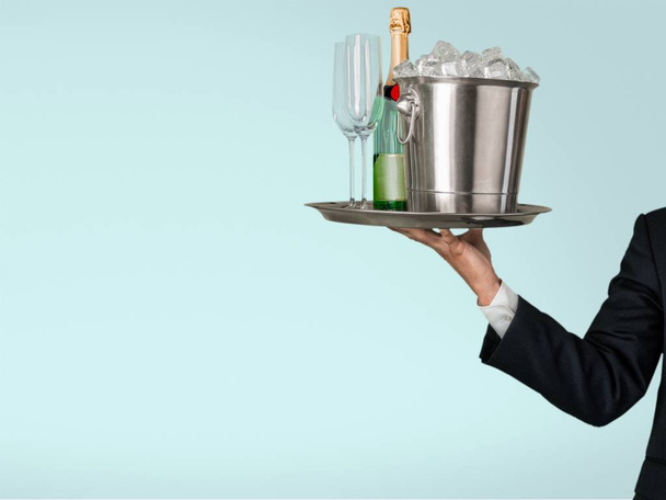Waiter with glasses of champagne isolated on background - Photo, Image