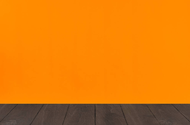 Halloween orange blank background with black wooden board shelf. - Foto, Imagen