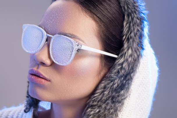 Trendy woman in sunglasses covered in frost - Photo, Image