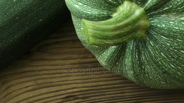 Fresh zucchini on a natural brown wooden background - Footage, Video