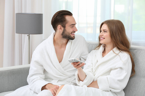 Young loving couple in bathrobes  - Foto, imagen