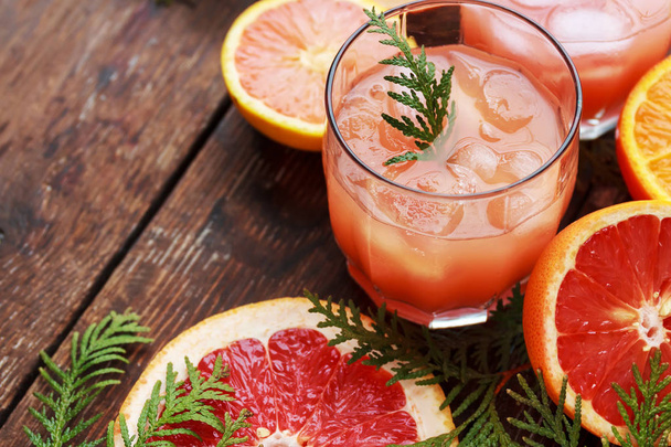 Glass of refreshing alcohol drink with orange juice, vodka or white rum served with ice orange slice. - Photo, Image