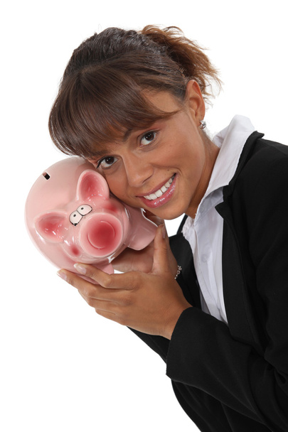 Businesswoman with a piggy bank - Fotoğraf, Görsel