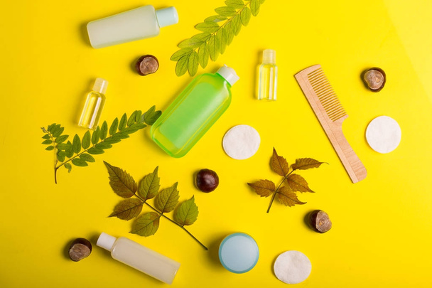 Cosmetics on a yellow background - Foto, Imagen