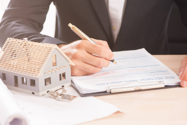 Mortgage Application Form - Hand Filling The Document Closeup - Fotó, kép