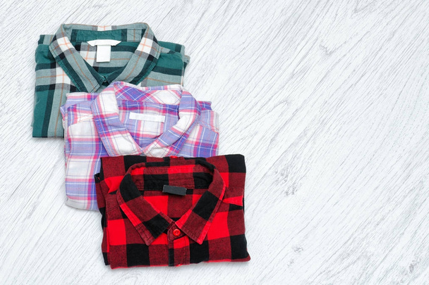 Green, red and lavender plaid shirts. Fashionable concept. Space for text - Photo, Image