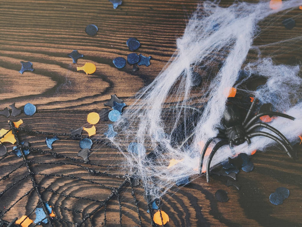 Halloween party confetti and spiders on dark - Foto, imagen
