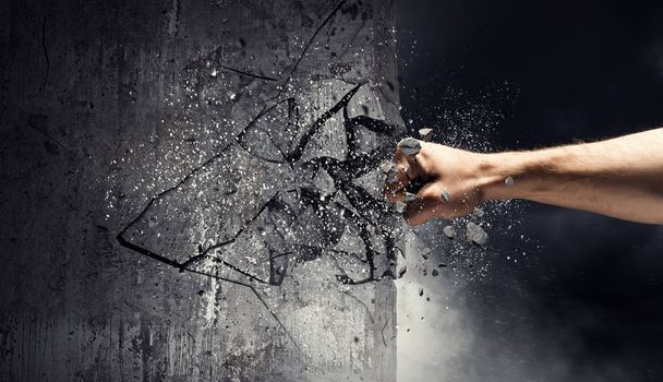 Hand breaking through the wall. Mixed media - Valokuva, kuva