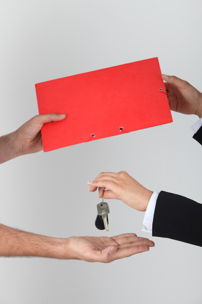 Exchanging keys and a folder - Фото, зображення