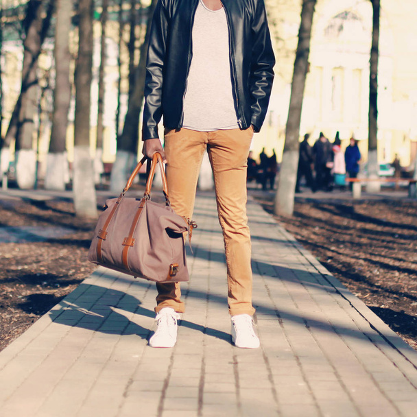 Fashion man with a bag on the street close-up - Foto, Imagem