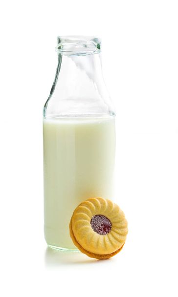 Jam ring biscuits and bottle of milk. - Photo, image