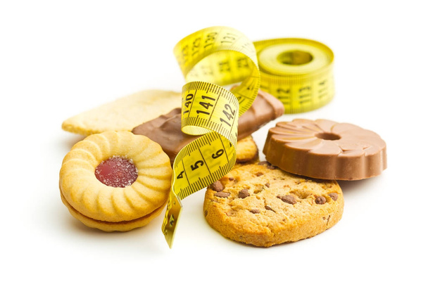Sweet biscuits and measuring tape. - Фото, зображення