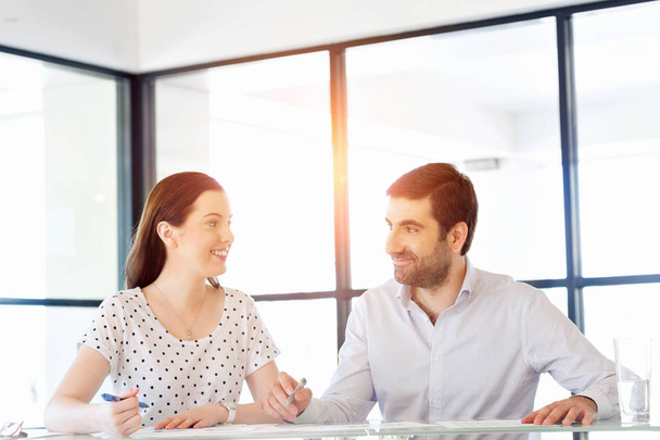 Image of two young business people in office - Foto, immagini