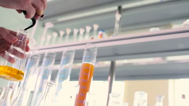 close-up of male hands working with liquor in test tube in modern Laboratory  - Video