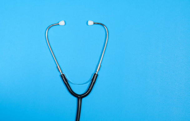 Medical stethoscope on blue background. - Foto, Imagem