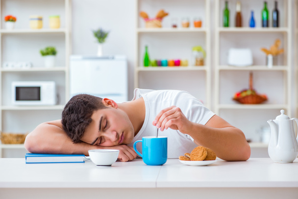 Man falling asleep during his breakfast after overtime work - Photo, Image